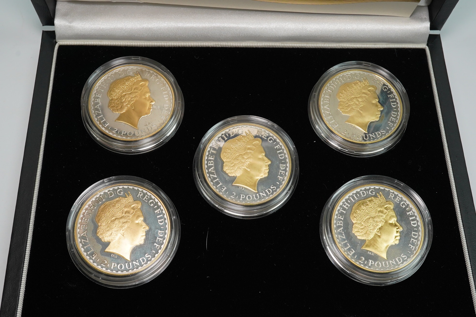 Royal Mint UK QEII coins, 2006 Britannia golden silhouette collection, a set of five proof silver and parcel gilt 1oz. Britannia coins, in case of issue with certificate